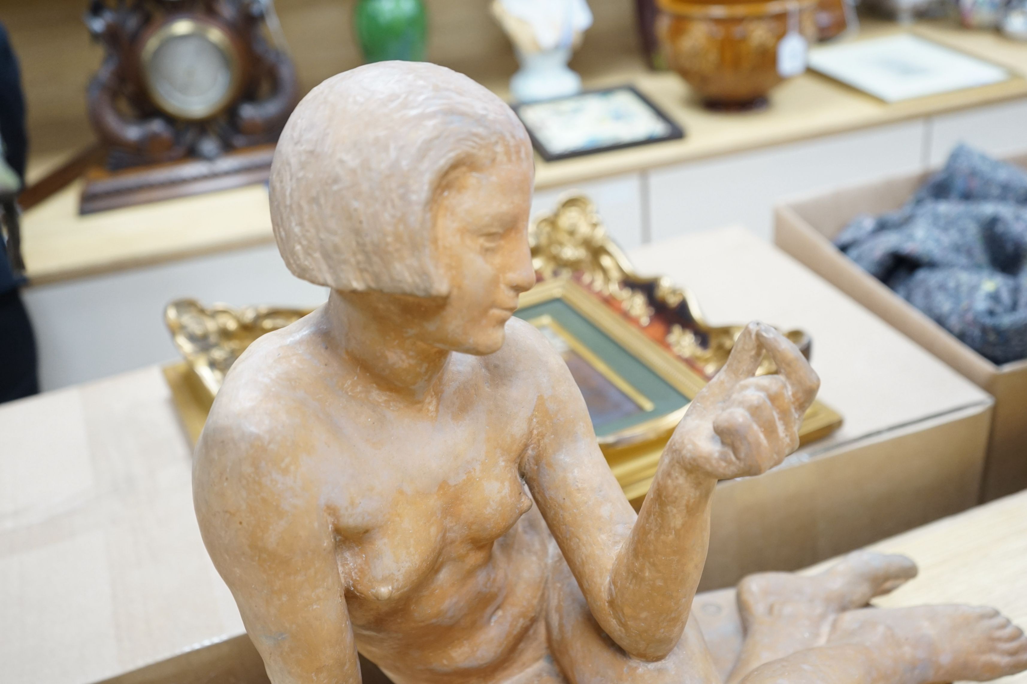 After Albert Patrisse (1892-1964), an Art Deco, signed and stamped, terracotta model of a recumbent nude, 50cms wide x 48cms high